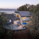 A house with solar panels on the roof, providing sustainable energy for the household.