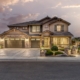 A picturesque home with a driveway leading to a garage.