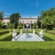 Photo of A serene garden with a beautiful fountain surrounded by neatly trimmed hedges.