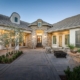 Photo of outdoor entry way to luxurious entrance to beautiful home and a furnished lounge patio