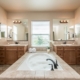 Photo of interior view of luxurious bathroom showing bubble-filled bathtub